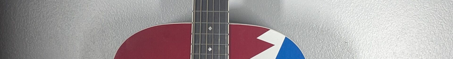 D’Angelico Grateful Dead Acoustic Guitar, w/custome bag, pro setup and warranty.